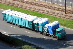 Old truck driving with portable toilets-cm